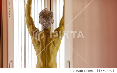Tanning salon senior man Tanning salon senior man 115692891