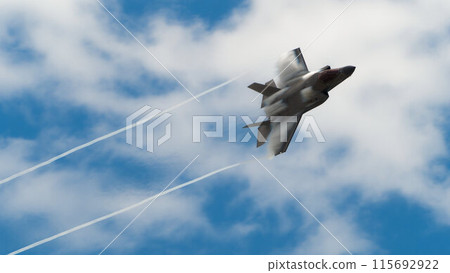 The F-35 Lightning fighter jet creates a Mach cone during maneuvering maneuvers. The F-35 Lightning fighter jet creates a Mach cone during maneuvering maneuvers. 115692922