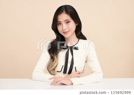 Beautiful young asian woman with clean fresh skin on beige background, Face care, Facial treatment, Cosmetology, beauty and spa, Asian women portrait. 115692999