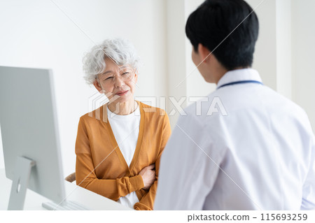 Senior woman receiving medical examination 115693259