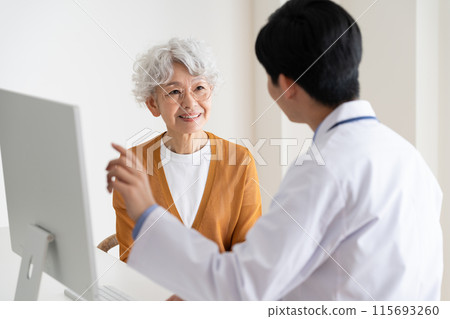 Senior woman receiving medical examination 115693260
