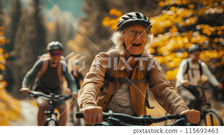 Happy old women cycling mountain bikes on a sunny day 115693463