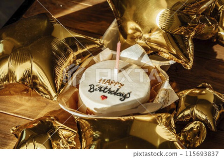 gold balloons and a beautifully simple birthday cake to mark the passage into adulthood 115693837