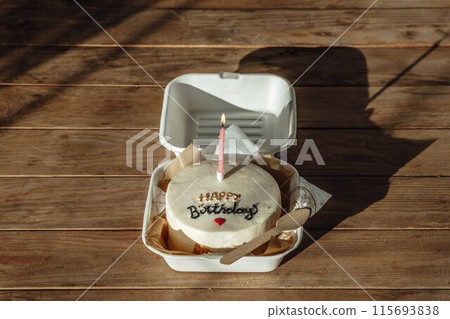 serene setting and straightforward presentation of the cake symbolize a no-frills approach to important life events serene setting and straightforward presentation of the cake symbolize a no-frills approach to important life events 115693838