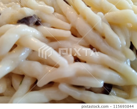 Italian pasta called trofie with vegetable sauce and cheese Italian pasta called trofie with vegetable sauce and cheese 115693844
