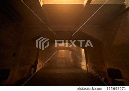 Dark concrete room with warm light Dark concrete room with warm light 115693971
