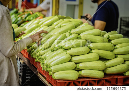 Large pile of fresh zucchini, organic vegetables at local farmers market 115694875