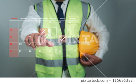 Architect or engineer Pointing finger at construction marking dates on virtual calendar, Project presentation plan, Construction cost planning, Construction planning, Appointment scheduler. 115695352