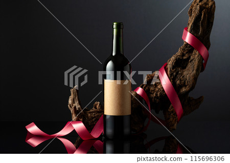 Bottle of red wine with old empty label. Bottle of red wine with old empty label. 115696306