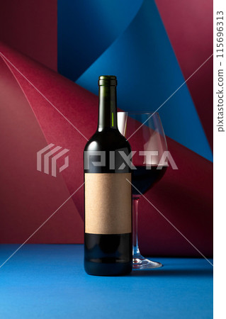 Bottle and glass of red wine. Bottle and glass of red wine. 115696313