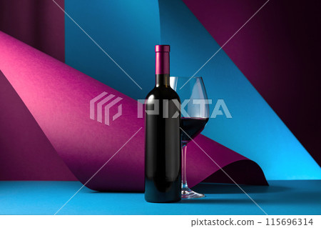 Bottle and glass of red wine. Bottle and glass of red wine. 115696314