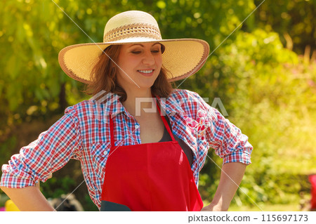 Portrait woman with hat in garden 115697173