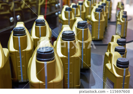 Plastic cans with motor oil Plastic cans with motor oil 115697608