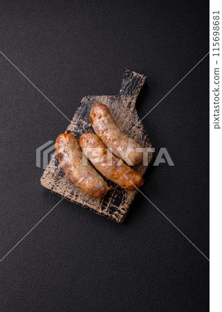 Baked chicken or pork sausages, salt, spices and herbs 115698681