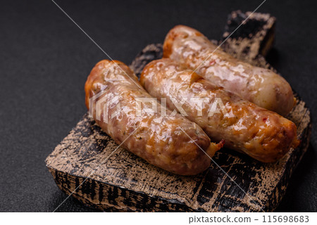 Baked chicken or pork sausages, salt, spices and herbs 115698683