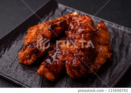 Delicious chicken fillet sliced and baked with teriyaki sauce Delicious chicken fillet sliced and baked with teriyaki sauce 115698793