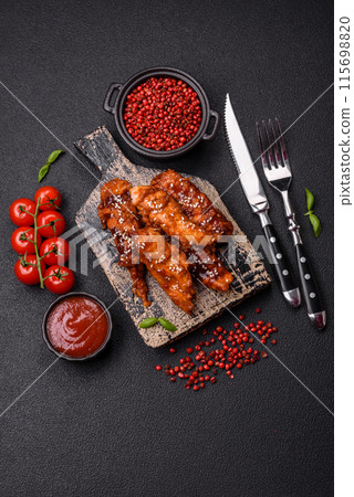 Delicious chicken fillet sliced and baked with teriyaki sauce Delicious chicken fillet sliced and baked with teriyaki sauce 115698820