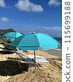 Beach umbrella, blue sea and beach chairs 115699188