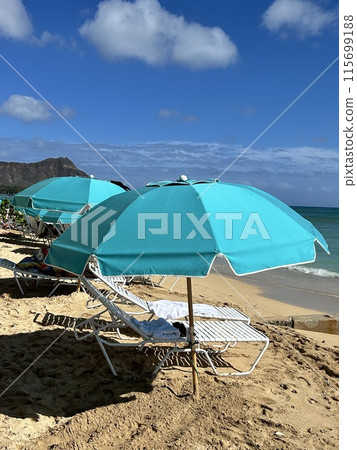 Beach umbrella, blue sea and beach chairs 115699188