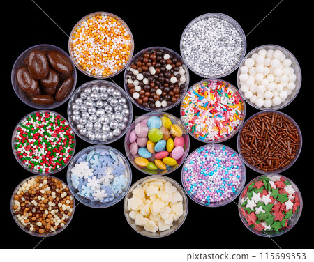 Colorful sugar and chocolate sprinkles, nonpareils in plastic cups, from above. Decoration and toppings in the shape of tiny pearls, snowflakes, hearts, rods, coffee beans and button-shaped candies. Colorful sugar and chocolate sprinkles, nonpareils in plastic cups, from above. Decoration and toppings in the shape of tiny pearls, snowflakes, hearts, rods, coffee beans and button-shaped candies. 115699353