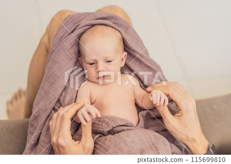 Dad and newborn at home. This tender moment captures the bond between father and child in a loving and comfortable family environment highlighting the joys of parenthood and the warmth of home Dad and newborn at home. This tender moment captures the bond between father and child in a loving and comfortable family environment highlighting the joys of parenthood and the warmth of home 115699810