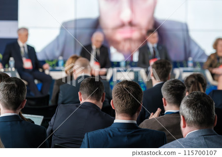 Business conference with professionals and audience participation 115700107