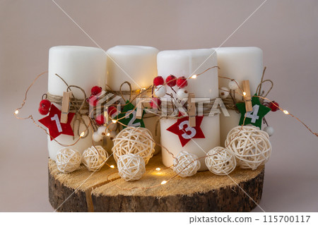 Step by step instruction of making handmade Christmas advent four weeks candle calendar. Female hands creating craft homemade decor. New year celebration. Winter holidays Step by step instruction of making handmade Christmas advent four weeks candle calendar. Female hands creating craft homemade decor. New year celebration. Winter holidays 115700117