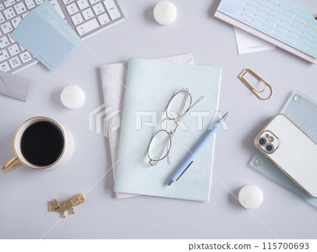 A simple computer desk image with a gray background 115700693