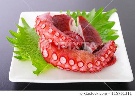 Deliciously boiled octopus legs 115701311