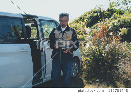 Seniors going out for river fishing by car Seniors going out for river fishing by car 115701448