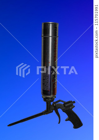 Gun for supplying construction foam. Odessa,Ukraine - 06.20.2024: Tool for fitting seams and gaps with construction foam.Illustrative. Gun for supplying construction foam. Odessa,Ukraine - 06.20.2024: Tool for fitting seams and gaps with construction foam.Illustrative. 115701991