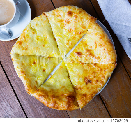 Delicious dish khachapuri Iveria with suluguni cheese Delicious dish khachapuri Iveria with suluguni cheese 115702409
