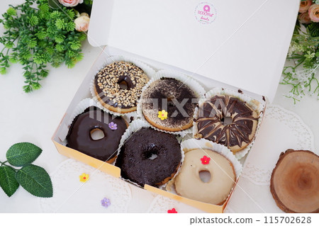 donuts with delicious layers as a background donuts with delicious layers as a background 115702628