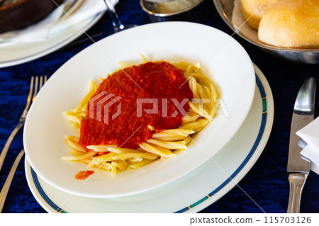 Trofie al pomodoro - spaghetti with tomato sauce. Italian cuisine 115703126