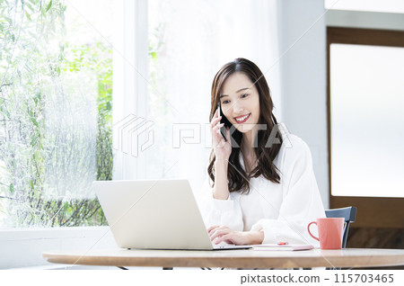 Young woman teleworking computer smartphone call phone Young woman teleworking computer smartphone call phone 115703465