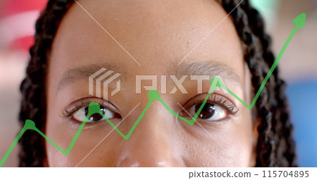 Image of diagram over biracial businesswoman opening eyes in office Image of diagram over biracial businesswoman opening eyes in office 115704895