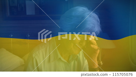 Image of flag of ukraine over senior caucasian woman crying Image of flag of ukraine over senior caucasian woman crying 115705076