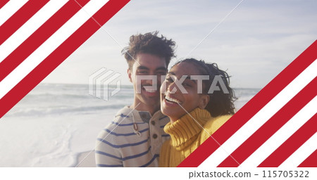 Image of flag of united states of america over biracial couple kissing by sea Image of flag of united states of america over biracial couple kissing by sea 115705322