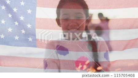 Biracial girl smiles behind a translucent American flag Biracial girl smiles behind a translucent American flag 115705408