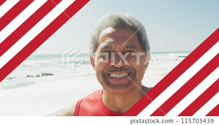 Image of flag of united states of america over senior biracial man on beach 115705439