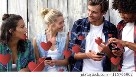 Digital composite of a group of teens leaning on a wooden fence texting and digital hearts flying in Digital composite of a group of teens leaning on a wooden fence texting and digital hearts flying in 115705902