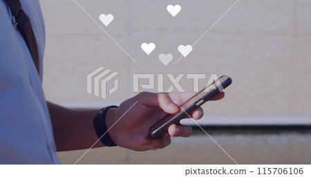 Image of social media reactions over hands of african american man using smartphone Image of social media reactions over hands of african american man using smartphone 115706106