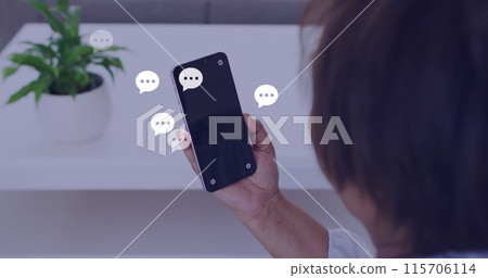 Image of social media reactions over hands of asian man using smartphone Image of social media reactions over hands of asian man using smartphone 115706114