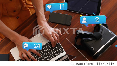 Image of social media icons falling over women using laptop Image of social media icons falling over women using laptop 115706116