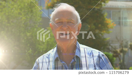Image of glowing lights over smiling senior man and trees in background Image of glowing lights over smiling senior man and trees in background 115706279