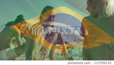 Image of flag of brazil waving over diverse friends discussing while sitting on beach Image of flag of brazil waving over diverse friends discussing while sitting on beach 115706316