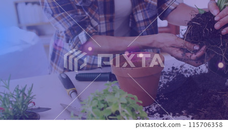 Image of blue lights over caucasian woman working in the garden 115706358