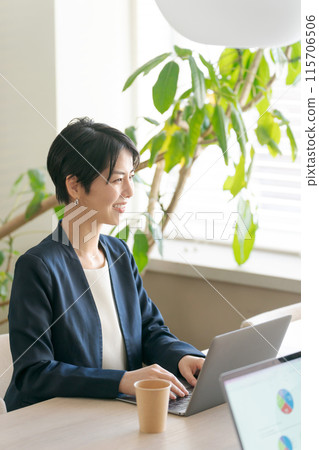 A woman having a meeting in a bright office A woman having a meeting in a bright office 115706506