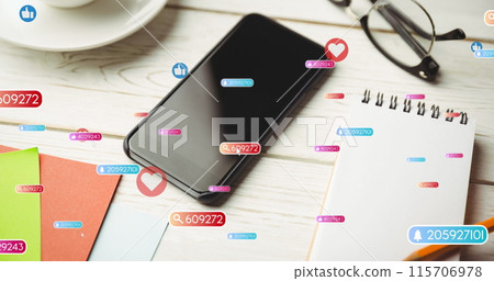 Image of social media like and love icons over smartphone on desk background Image of social media like and love icons over smartphone on desk background 115706978