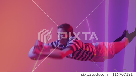 Image of neon lights over female rugby player on neon background Image of neon lights over female rugby player on neon background 115707181